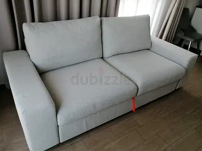 Light beige 2-seater sofa bed in good condition vimle