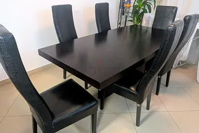 Solid dark wood dining table with 6 high-back chairs - very good condition and quality.