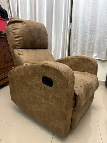 Comfortable brown reclining armchair in good condition