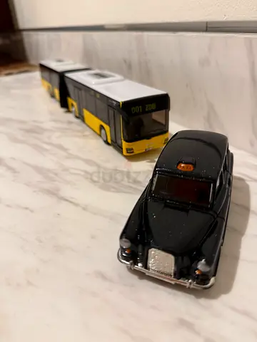 Yellow bus and London taxi toy car