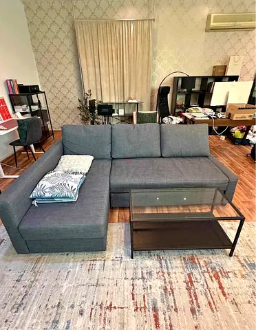 Grey L-shaped Sofa  bed with Storage Chaise — Good Condition