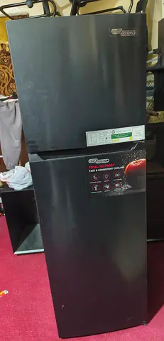 Used two-door refrigerator - black finish, good working condition