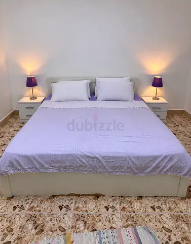 White king size bed frame with nightstand  tables and brand new  mattress with 3 door wardrobe