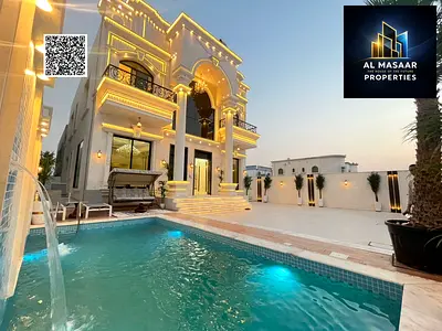 A dream villa in Al Muwaihat 2 featuring a classic design, situated in a prime location in Ajman close to all amenities; includes a swimming pool, a l