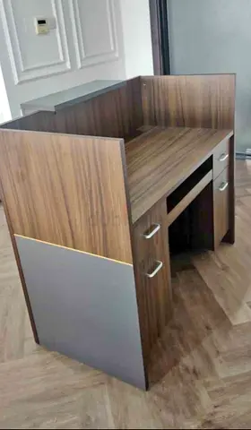 Compact wooden study desk with storage drawers — good condition