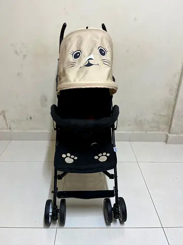 Moon baby stroller used once with cute hood and paw-print seat
