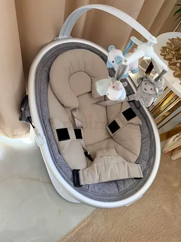 Baby rocker/bouncer seat with soft insert and toy mobile
