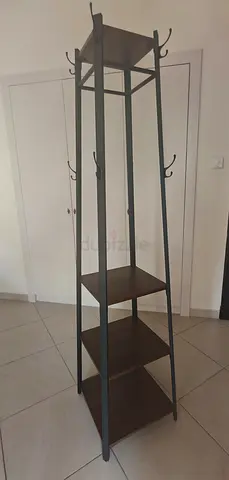 Tall freestanding coat rack with 3 shelves and multiple hooks