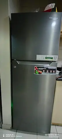 Two-door silver refrigerator in good working condition