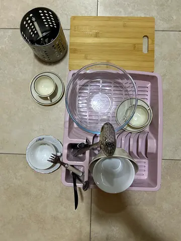 Used Kitchen Dish Rack with Utensils and Cutting Board