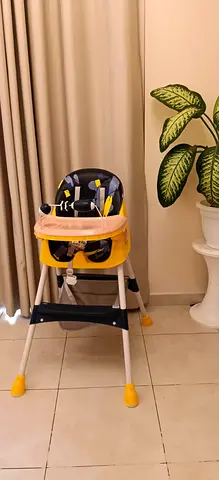 Used yellow and navy baby high chair with tray - good condition