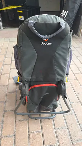 Deuter child carrier backpack with foldable stand — good condition