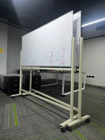 Mobile double-sided whiteboard on wheels - sturdy office flip board