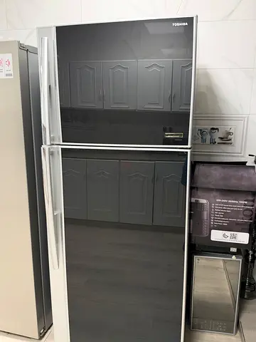 Double-door refrigerator in good working condition