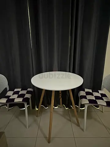 Small round dining/side table with wooden legs and 2 chairs