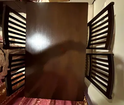 Solid wood dining table with 4 chairs - dark brown, good condition