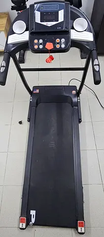 Used folding "POWERMAX TDM-97" treadmill in good working condition.