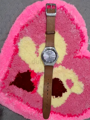 Classic silver dial woman's wristwatch with brown leather strap