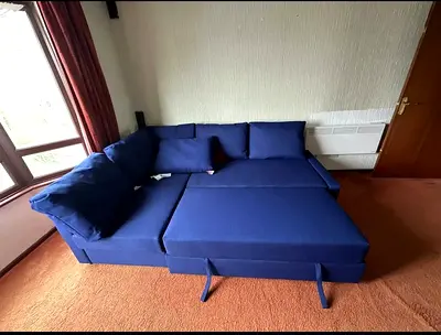 Blue L-shaped Sofa Bed with Storage - Good Condition