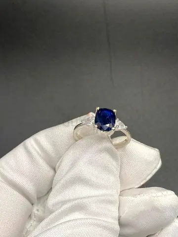 Sterling Silver Ring with heated Blue Sapphire 2 ct approximately Center and Side Stones
