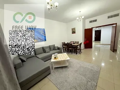 Furnished two-bedroom apartment with a living room for monthly rent in Ajman, on the Corniche.