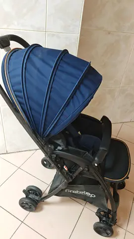Lightweight navy stroller in good condition - folds compact