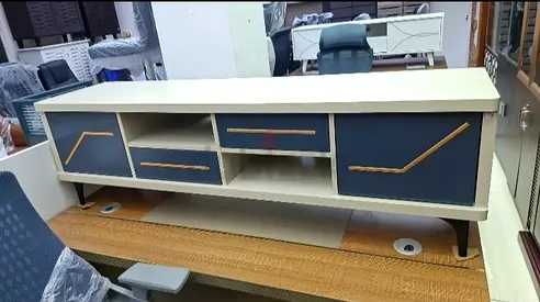 Modern low TV console / media unit with blue drawers