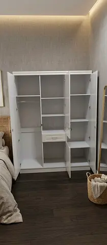 White 3-Door Wardrobe with Multiple Shelves and Drawer