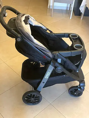 Used reversible travel stroller with cup holders - good condition
