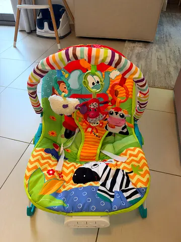 FREE Bright colorful baby bouncer / rocker with toys - good condition
