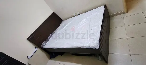 Queen size bed and mattress/ cupboard