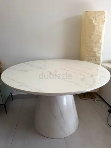 Round white marble-effect pedestal dining table