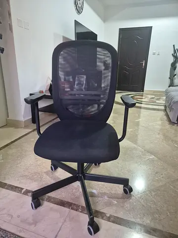 Black mesh swivel office chair with armrests - good condition, clean, no stains.