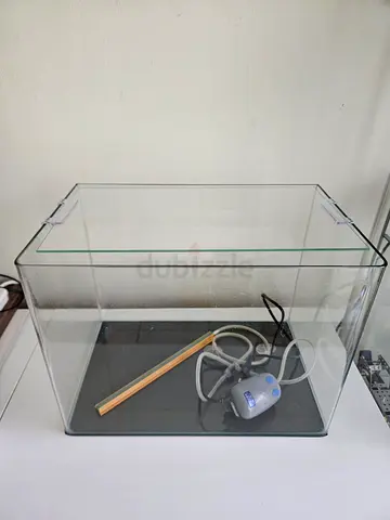 Glass aquarium tank with filter and accessories - good condition