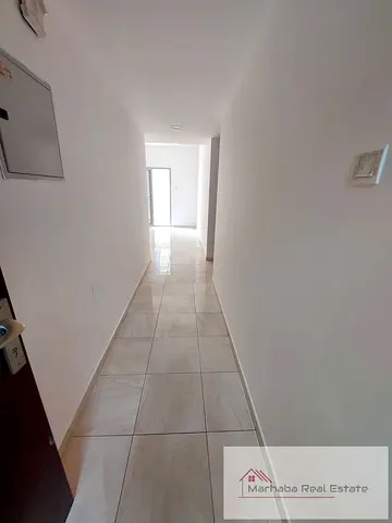 Spacious 1-Bedroom Hall Apartment with Balcony Central AC. Al Rashidiya 1, Ajman.