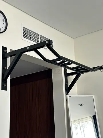Wall-mounted pull-up / monkey bar for home gym