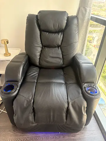Black leather electric recliner chair with cup holders , side boxes and LED lights