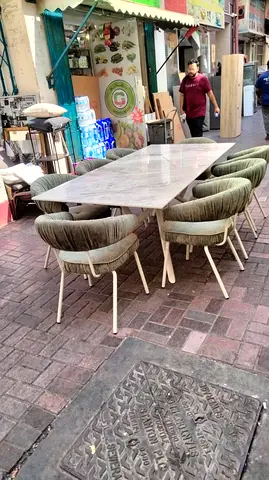 Marble-top dining table with  8 upholstered chairs - good condition