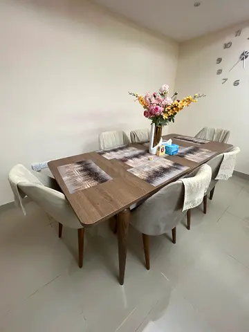 Wooden dining table with 6/4 table having extendable options upholstered chairs - gently used
