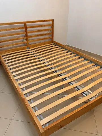 Solid wood slatted double bed frame with headboard - good condition