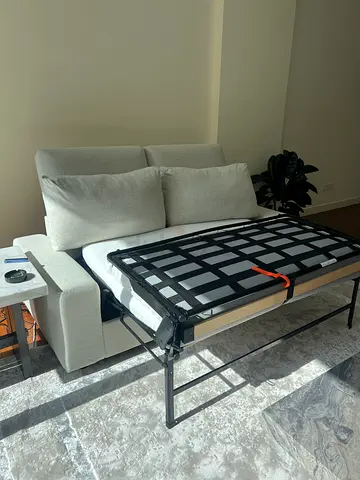 Light beige 2-seater sofa bed in good condition vimle