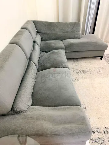 Light grey L-shaped sectional sofa with chaise
