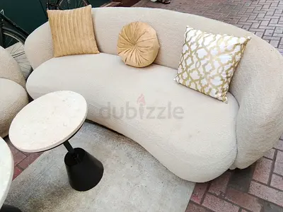 Curved boucle 2-seater sofa in cream — cosy modern design