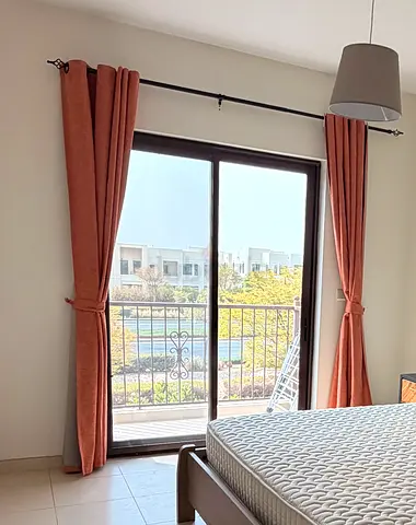 Pair of orange-colored blackout curtains