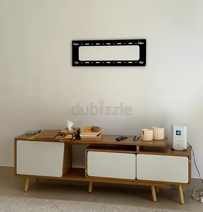 Low-profile wooden TV cabinet with storage drawers