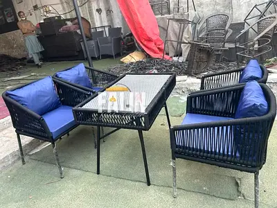 Outdoor rattan-style 4-piece patio seating set with cushions