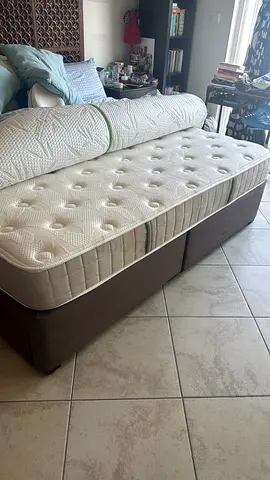 A king size bed 2meter by 2 meter with 2 large drawers under the bed. Bought in 2021