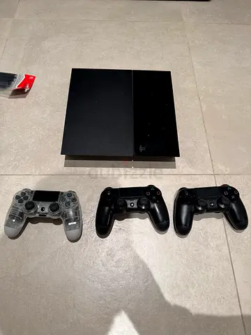 Sony PlayStation 4 console with 3 DualShock controllers (good working condition)