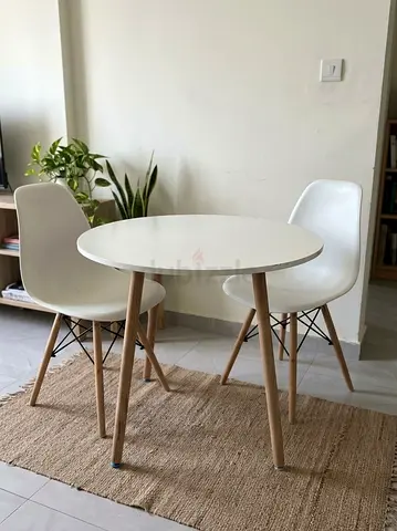 Small round dining table with 2 white chairs - Ikea-style