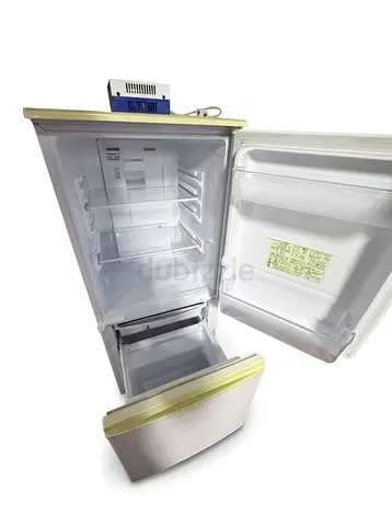 Compact top-freezer refrigerator with bottom drawer - used, clean